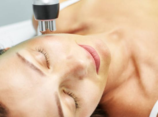 woman receiving a thermalift treatment on her face to stimulate collagen and elastin